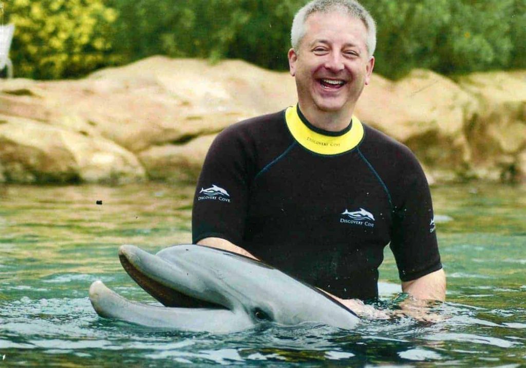 Keith swimming with dolphins in Florida